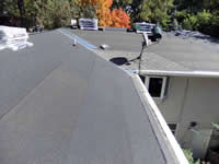 Shingles off and new tar paper on.